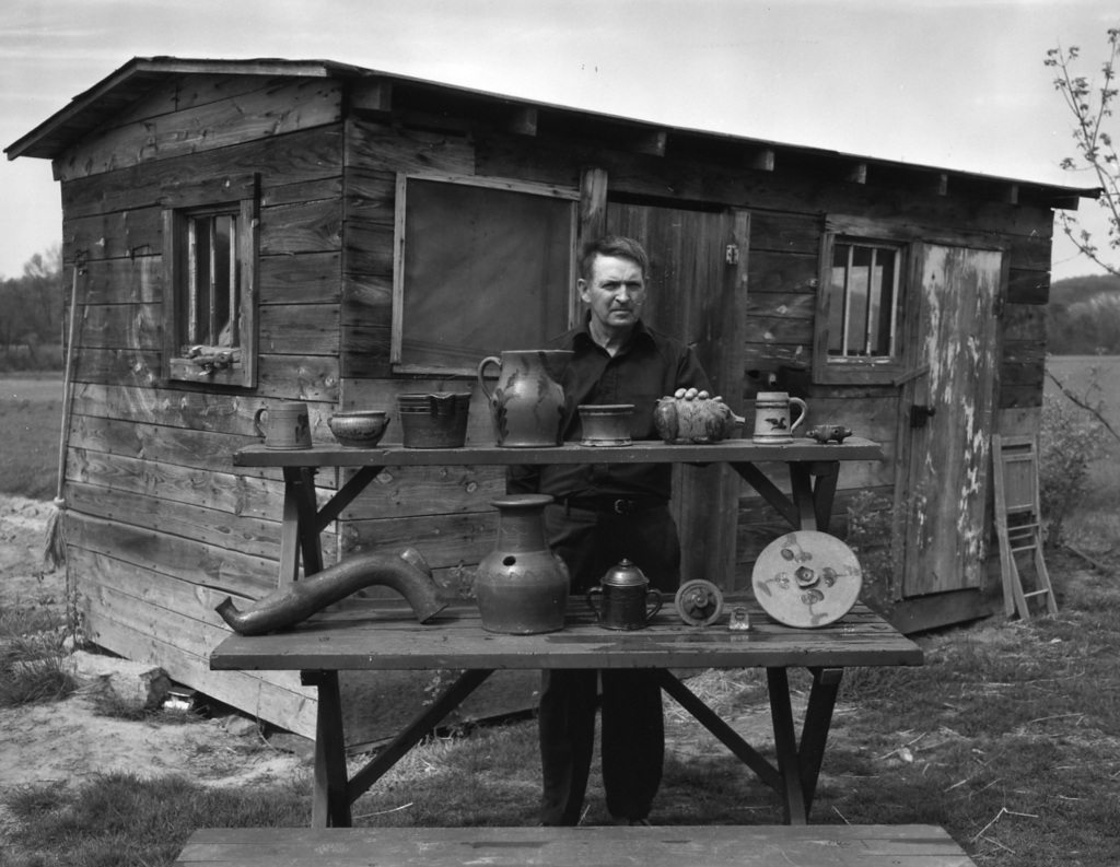 Harry Decker, a grandson of Charles, Sr. with his favorite piece of Decker pottery, the decorated pig bank. It is believed to have been made while Decker was still in Philadelphia. Seen in the Tennessee Conservationist. Burbage6.