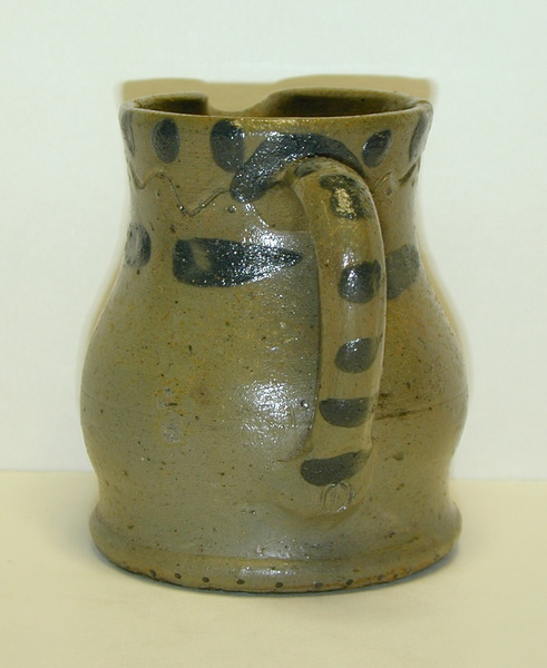 Handle view of A Present Decker pitcher. ai38.