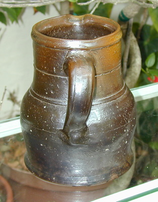 Handle view of Decker pitcher. ai35b.