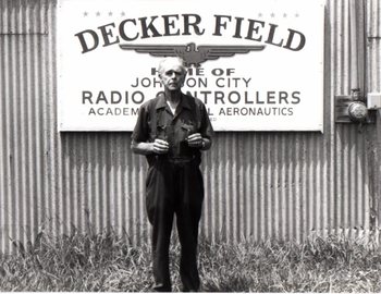 Dick Decker holding Uncle Billyâ€™s grafting knife and leather punch. illus27.